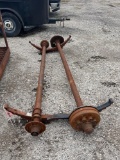 2 TRAILER AXLES ONE WITH HUBS AND BRAKES... 8 LUG HUBS ON BOTH...