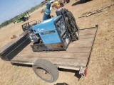 BOBCAT 225G MILLER WELDER ON TRAILER WITH LEADS AND BOTTLES SOME TOOLS IN BOX SELLS WITH BILL OF