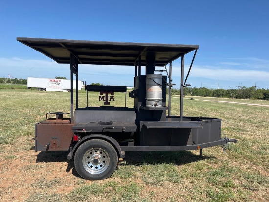 TEXAS AGGIE SMOKER ON TRAILER USED 3 TIMES GRILL OVER THE FIREBOX PROPANE RUNS THROUGH THE FIREBOX