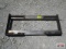 Heavy duty weld on skid steer backing attachment plate