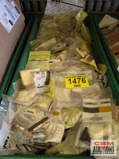 Large assortment of Case New Holland parts, new in packages with part numbers. TOTE NOT INCLUDED