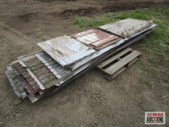 Pallet of used barn metal and 3 wooden barn doors