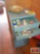 Metal cabinet, assorted pens, decorative tape, staplers and staples, and large shell