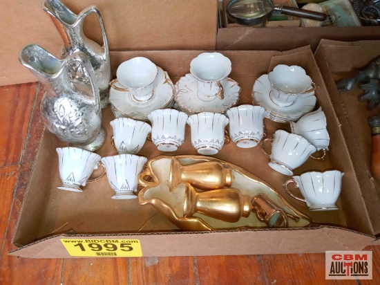 Tea cups and decorative pitchers