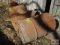 3 Assorted metal barrels, 1 is filled with concrete, and a vintage sieve or funnel