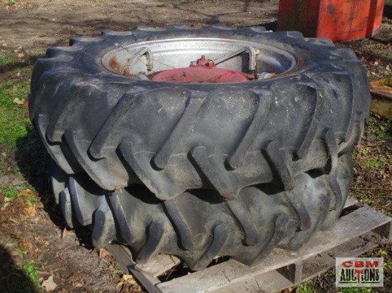 Pair of used tractor tires and wheels with some rust, one is 14.9-28, the other is 13.6-28