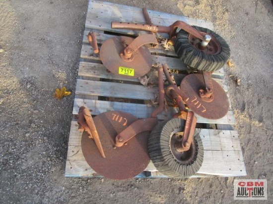 3 - Plow coulters and 2 - brush hog tail wheels......