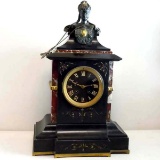 FRENCH MARBLE ONYX BRONZE FEMALE FIGURAL MANTLE CLOCK; with a signed Japy Freres movement,