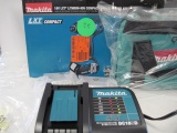 Makita assortment - 18 volt charger, 2 batteries, tool bag (no tool)