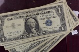 LOT of 10: 1957 $1 Silver Certificates including one star note.