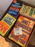 Dozens Of Janet Evanovich Hard Cover And Paperback Books