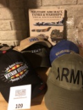 Military hats and book
