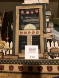 Group of home décor wooden art and other items.