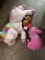 Three unicorn and stick horse stuffed animals