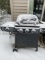 Char-Broil outdoor grill with propane tank