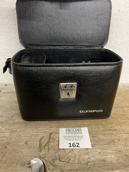 Olympus OM 10 mid century camera in bag