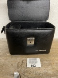 Olympus OM 10 mid century camera in bag
