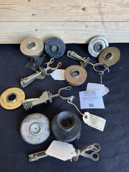 Large group of antique telephone transmitters, switchhooks and parts