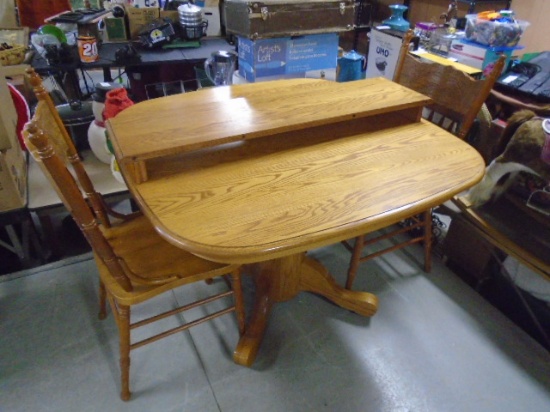 Solid Oak Pedistal Dining Table w/ Leaf & Two Chairs