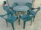Round Glass Top Patio Table w/ 6 Resin Stacking Chairs