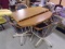 Dining Table w/ Center Leaf w/ 4 Matching Rolling Chairs