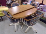 Dining Table w/ Center Leaf w/ 4 Matching Rolling Chairs