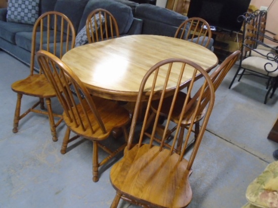 Solid Oak Pedestal Dining Table w/Center Leaf and 6 Matching Chairs