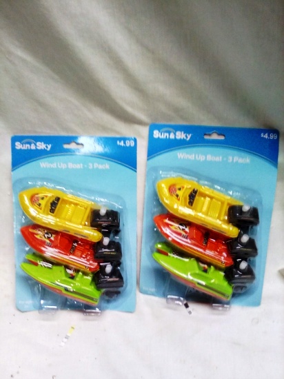 2     3packs of Wind Up Boats