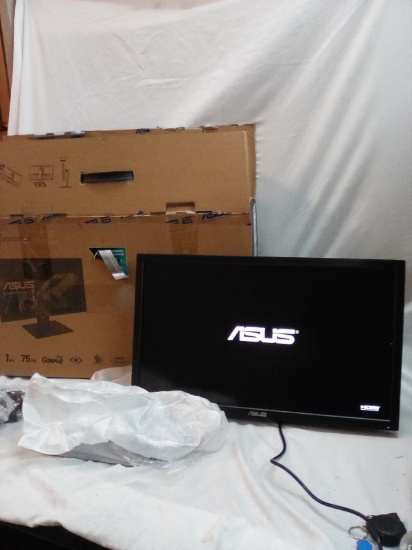 Asus Gaming monitor with swivel stand 24in plugged in turns on