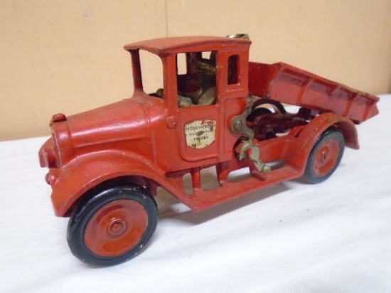 Vintage Cast Iron International Dump Truck w/ Driver