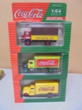 Group of (3) 1:64 Scale Die Cast Coca-Cola Trucks