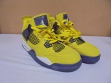 Pair of Nike Air Jordan 4 Midrise Lightning Yellow Shoes