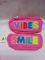 2 pink pouches (Vibes, Smile)