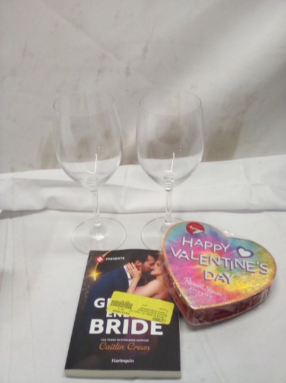 2 wine glasses , book and box of chocolate in date