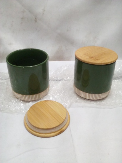 Pair of 4.5”Tx4”D Assorted Ceramic Canisters w/ Wooden Lids