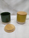 Pair of 4.5”Tx4”D Assorted Ceramic Canisters w/ Wooden Lids