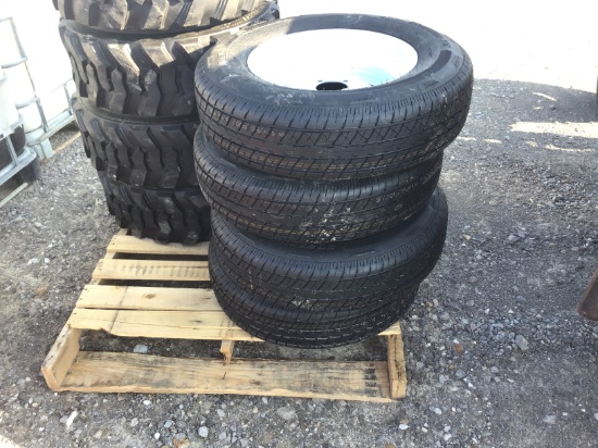 (4) NEW ST205/75/15 RADIAL TRAILER TIRES AND WHEELS