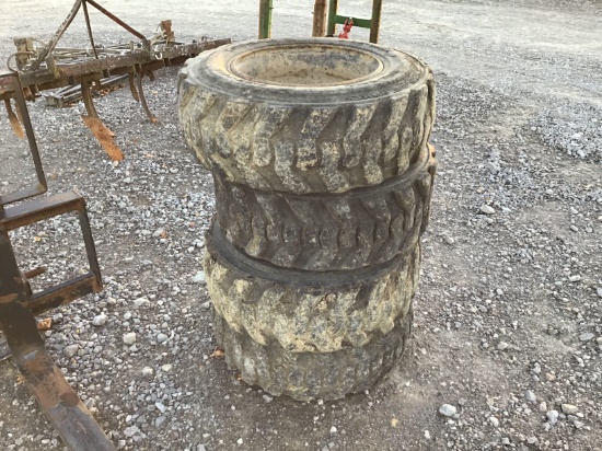 (4) 10-16.5 SKID STEER TIRES AND RIMS