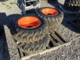 (4) NEW 10-16.5 SKID STEER TIRES AND RIMS (BOBCAT) - ALL ONE PRICE