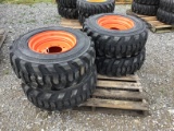 (4) NEW 12-16.5 BOBCAT SKID STEER TIRES AND RIMS - ALL ONE PRICE