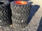 (4) NEW 10-16.5 SKID STEER TIRES AND RIMS (ORANGE) - ALL ONE PRICE