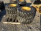 (4) NEW 12-16.5 SKID STEER TIRES AND RIMS - ALL ONE PRICE