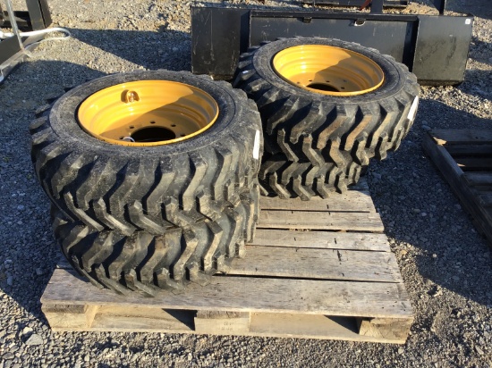 (4) NEW 10-16.5 SKID STEER TIRES AND RIMS - ALL ONE PRICE