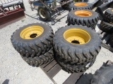 (4) NEW 12-16.5 YELLOW SKID STEER TIRES AND RIMS - ALL ONE PRICE