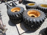 (4) NEW 12-16.5 YELLOW SKID STEER TIRES AND RIMS - ALL ONE PRICE