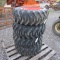 (4) NEW 10-16.5 SKID STEER TIRES AND RIMS (ORANGE) - ALL ONE PRICE