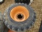 (4) USED 12-16.5 SKID STEER TIRES AND RIMS - ALL ONE PRICE