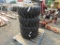 (4) NEW 12-16.5 SKID STEER TIRES ON YELLOW RIMS - ALL ONE PRICE