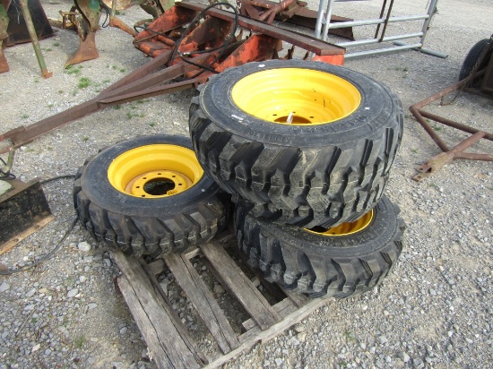 (4) NEW 10-16.5 YELLOW SKID STEER TIRES AND RIMS