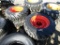 (4) NEW 10-16.5 SKID STEER TIRES ON ORANGE RIMS - ALL ONE PRICE